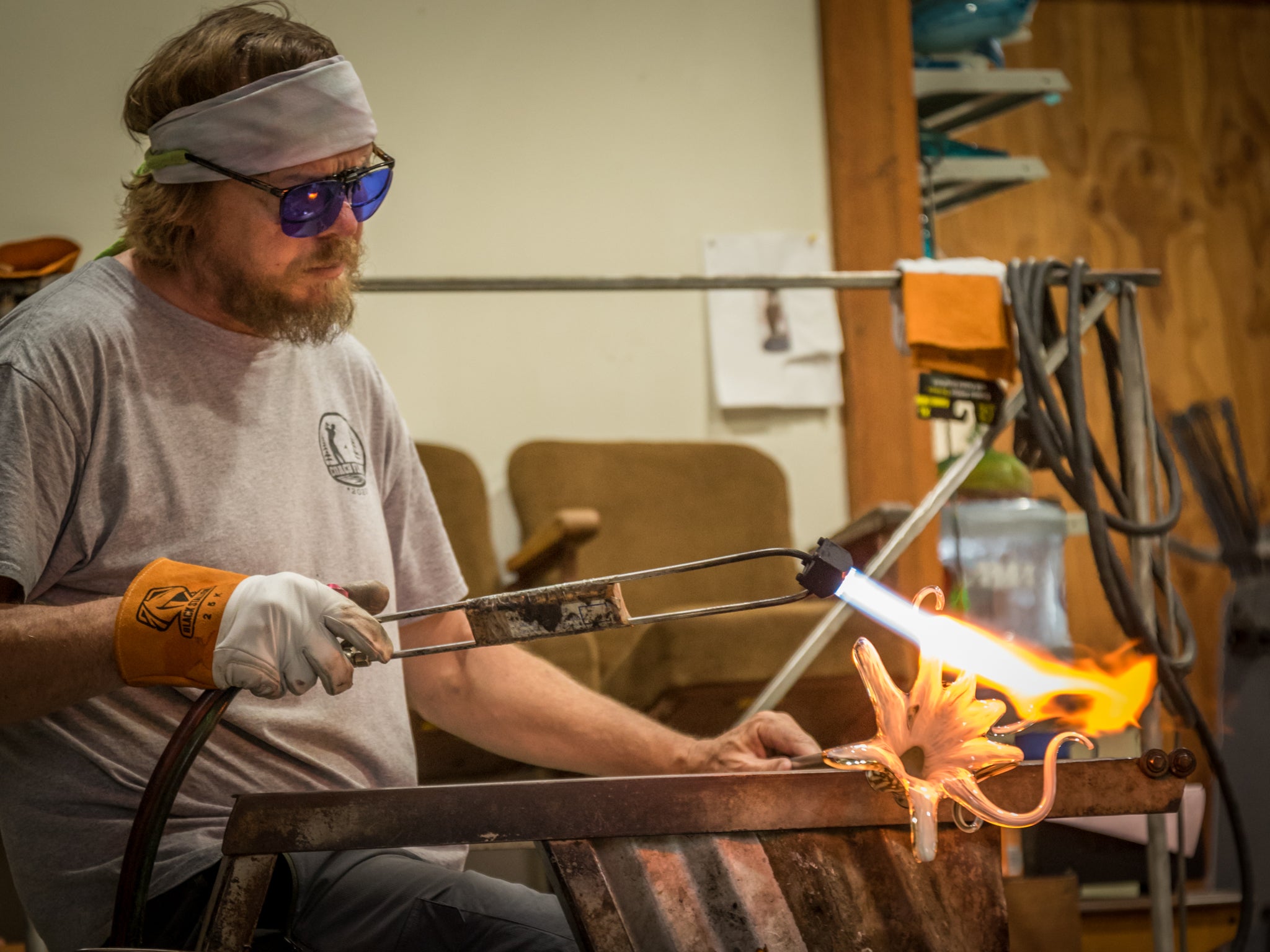 Michael Hopko hand blowing glass octopus in studio