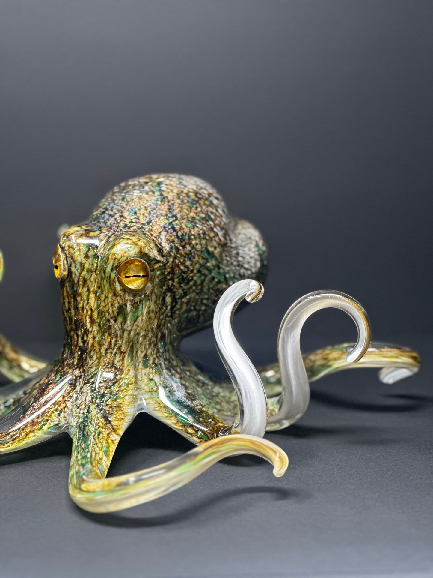 Decorative Hopko Art Glass octopus sculpture on a gray background